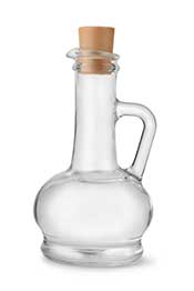 Vinegar: Rich in Acetic Acid and Other Healthy Compounds. Picture of Vinegar in a Clear Glass Bottle.