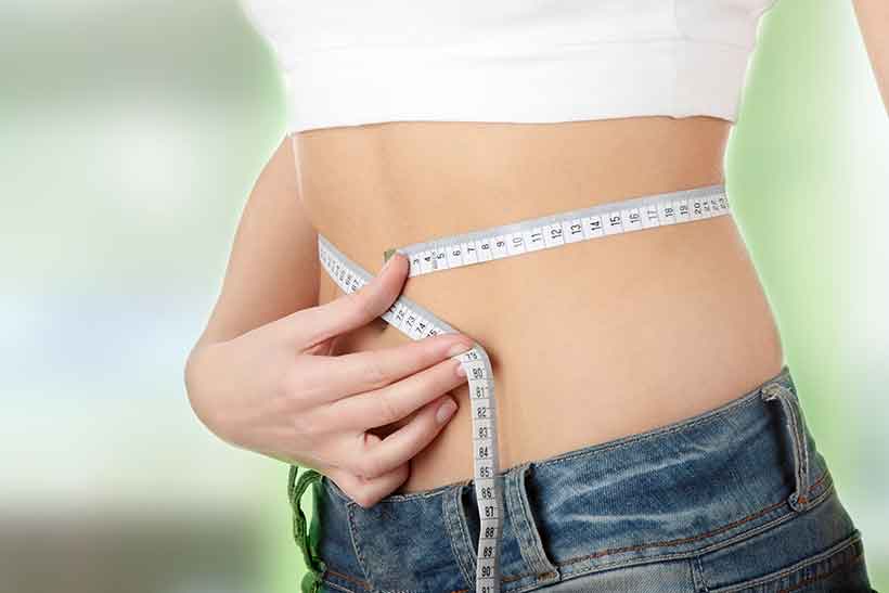 The Steak and Eggs Diet is Popular For Weight Loss. A Girl Measuring Her Weight to Check For Weight Loss.