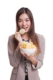 Can I Have a Cheat Day? Young Lady Eating Unhealthy Food On a "Cheat Day".