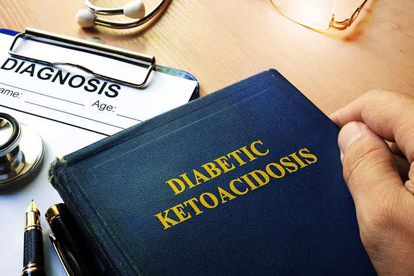 Does the Ketogenic Diet Cause Ketoacidosis? Someone Reading a Book About Diabetic Ketoacidosis.