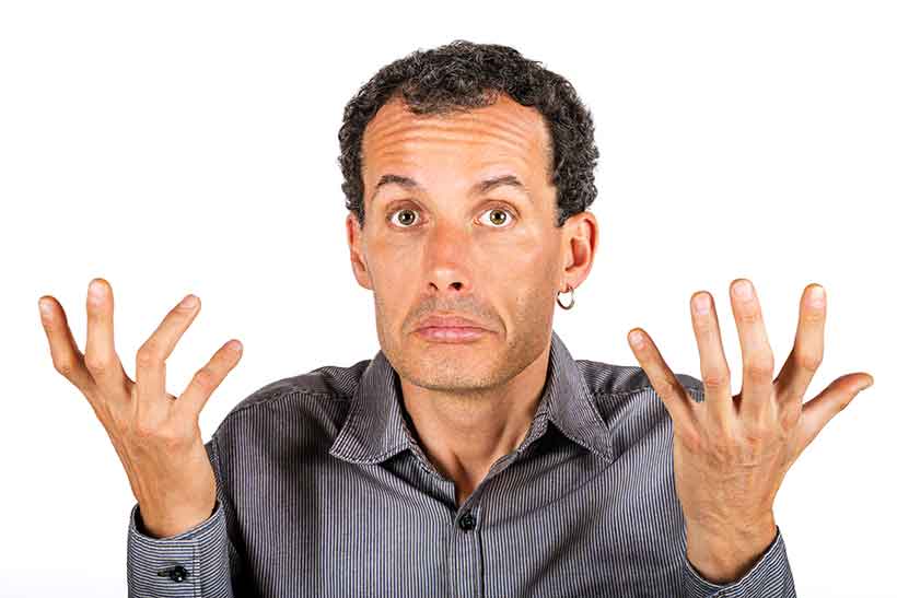 Is a High Protein, Low Carb Diet Right For Everyone? Man Feeling Confused Doing An 'I Don't Know' Gesture.