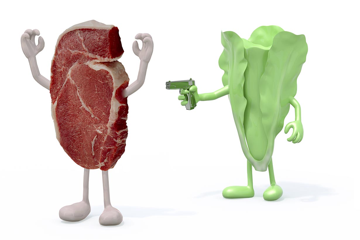 Picture of lettuce holding a gun to beef - meat vs vegan diet theme.