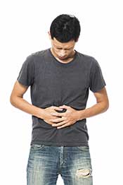 A Man Holding His Stomach Feeling Sick.