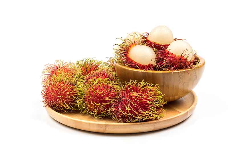 Rambutan: Purple Hairy Fruit With Soft White Fruit Inside.