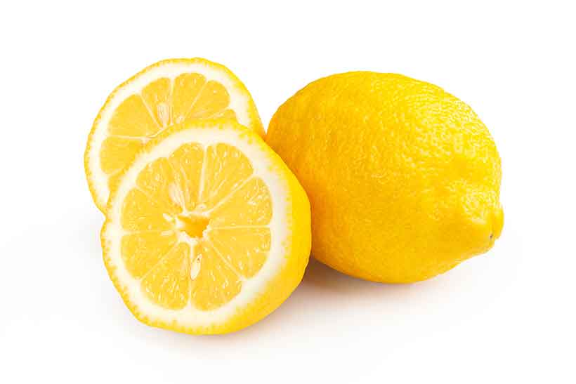 Whole Lemon Citrus Fruit and Two Lemon Halves.