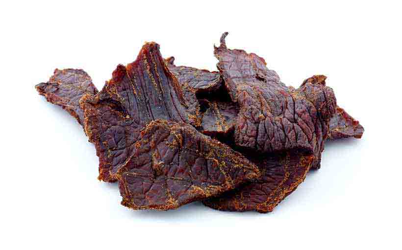 Pieces of Beef Jerky On a White Background.